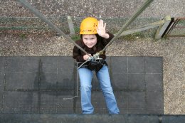 A Brownie abseiling