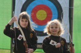 Brownies doing archery at Foxlease