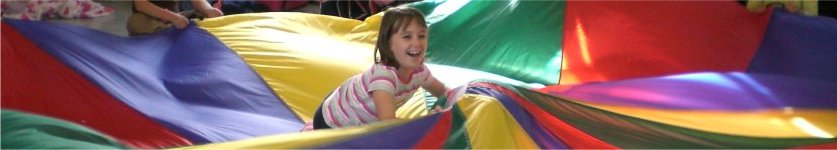 A Brownie playing parachute games